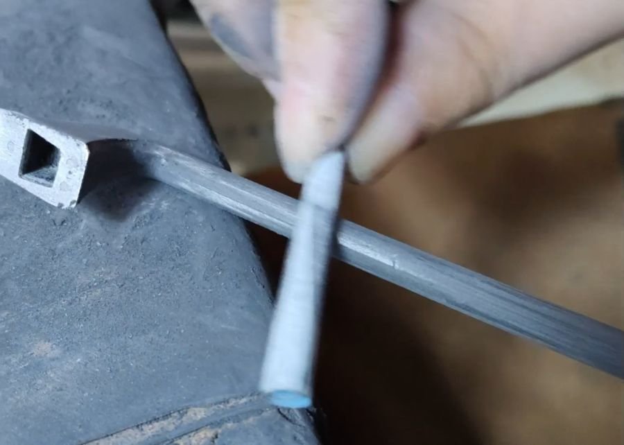 Carbon fiber violin bow shaft during varnishing